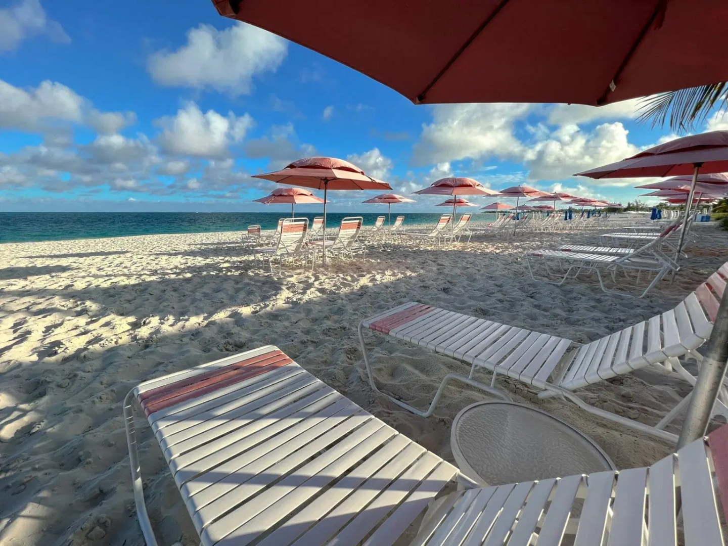 an umbrella sitting on top of a beach
