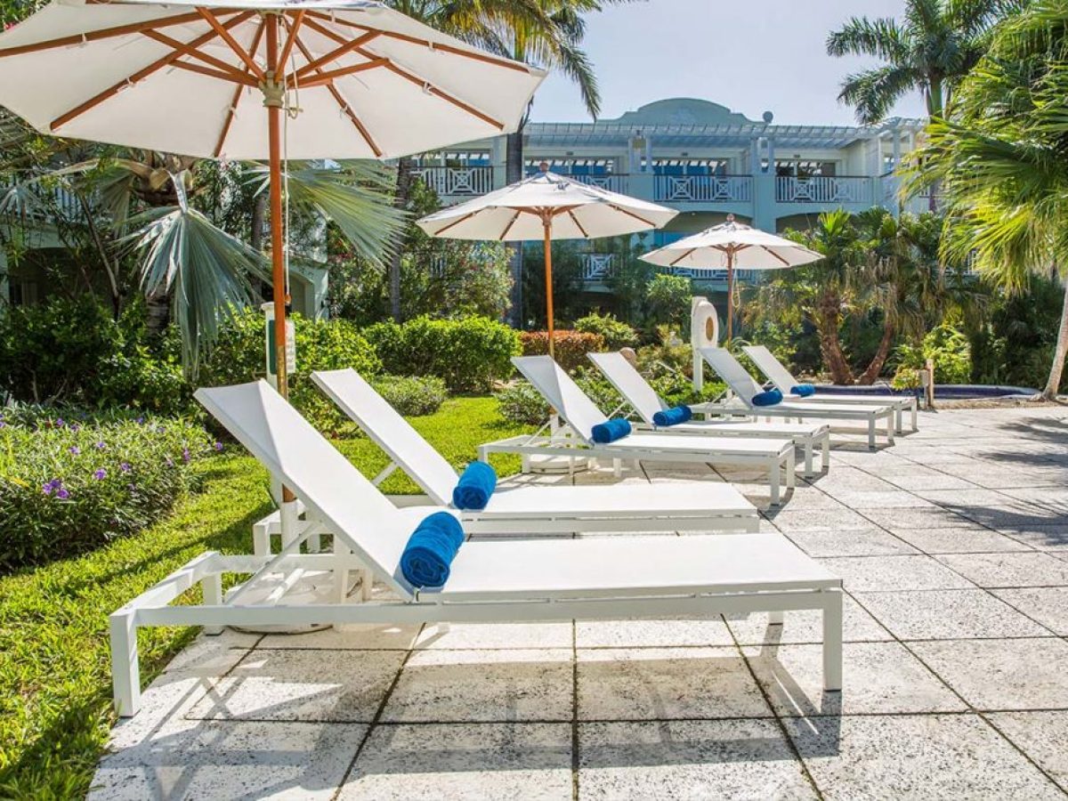 an umbrella sitting on top of a chair