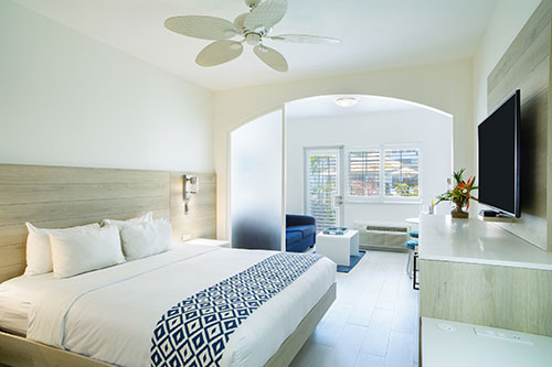Ports-of-Call-0587 a bedroom with a large bed in a room