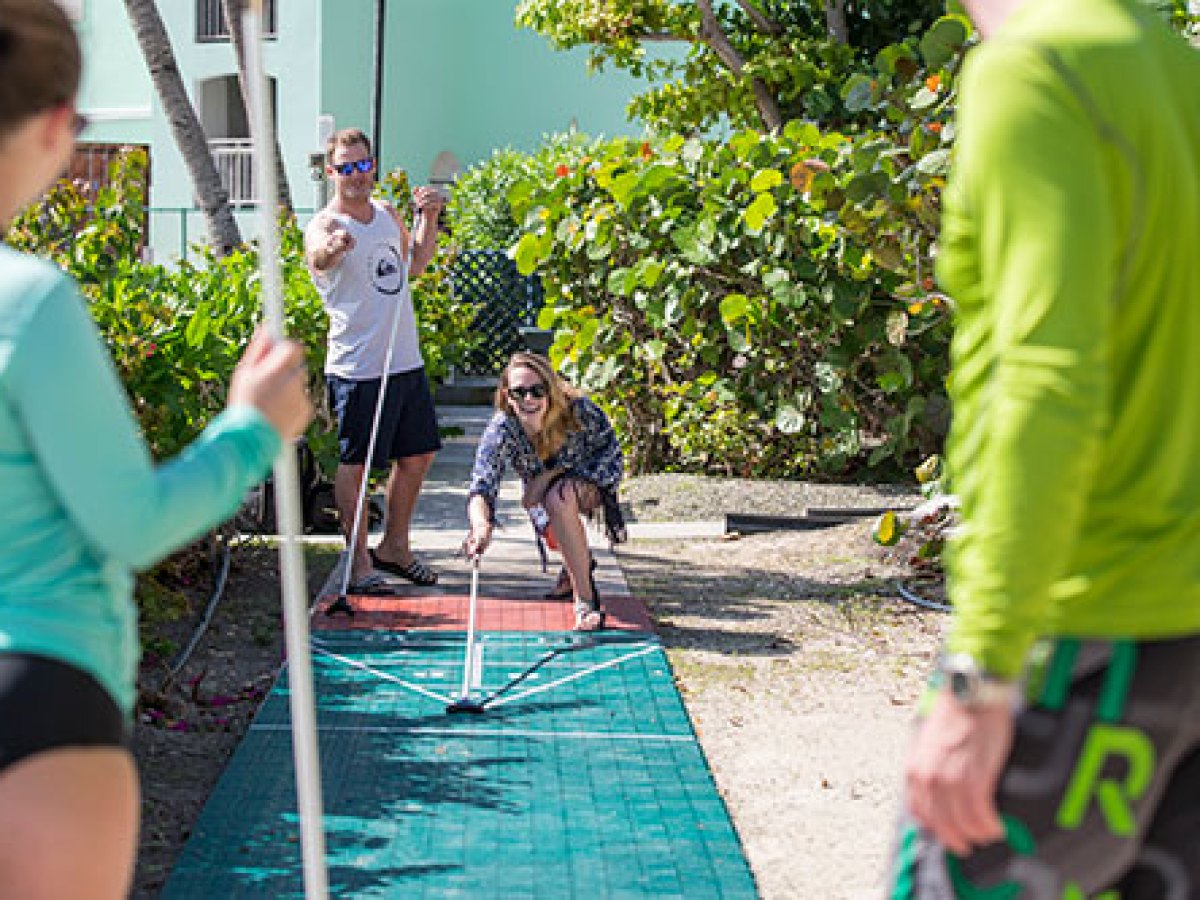 a young girl holding a football ball