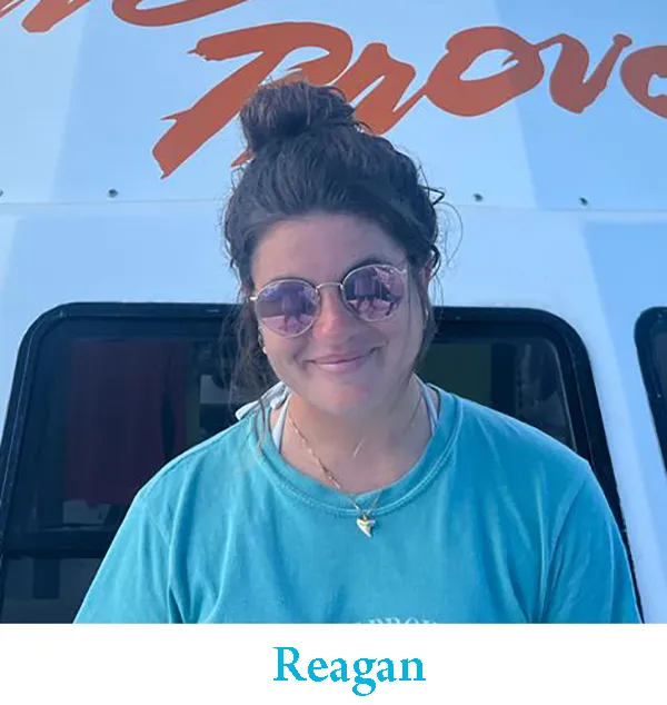 a person standing in front of a car