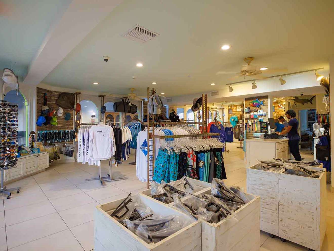 a group of people standing in a kitchen
