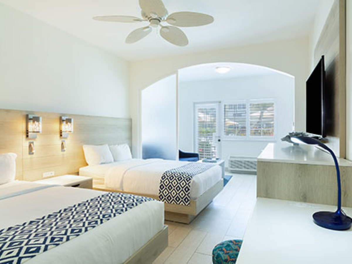 a bedroom with a large bed in a room